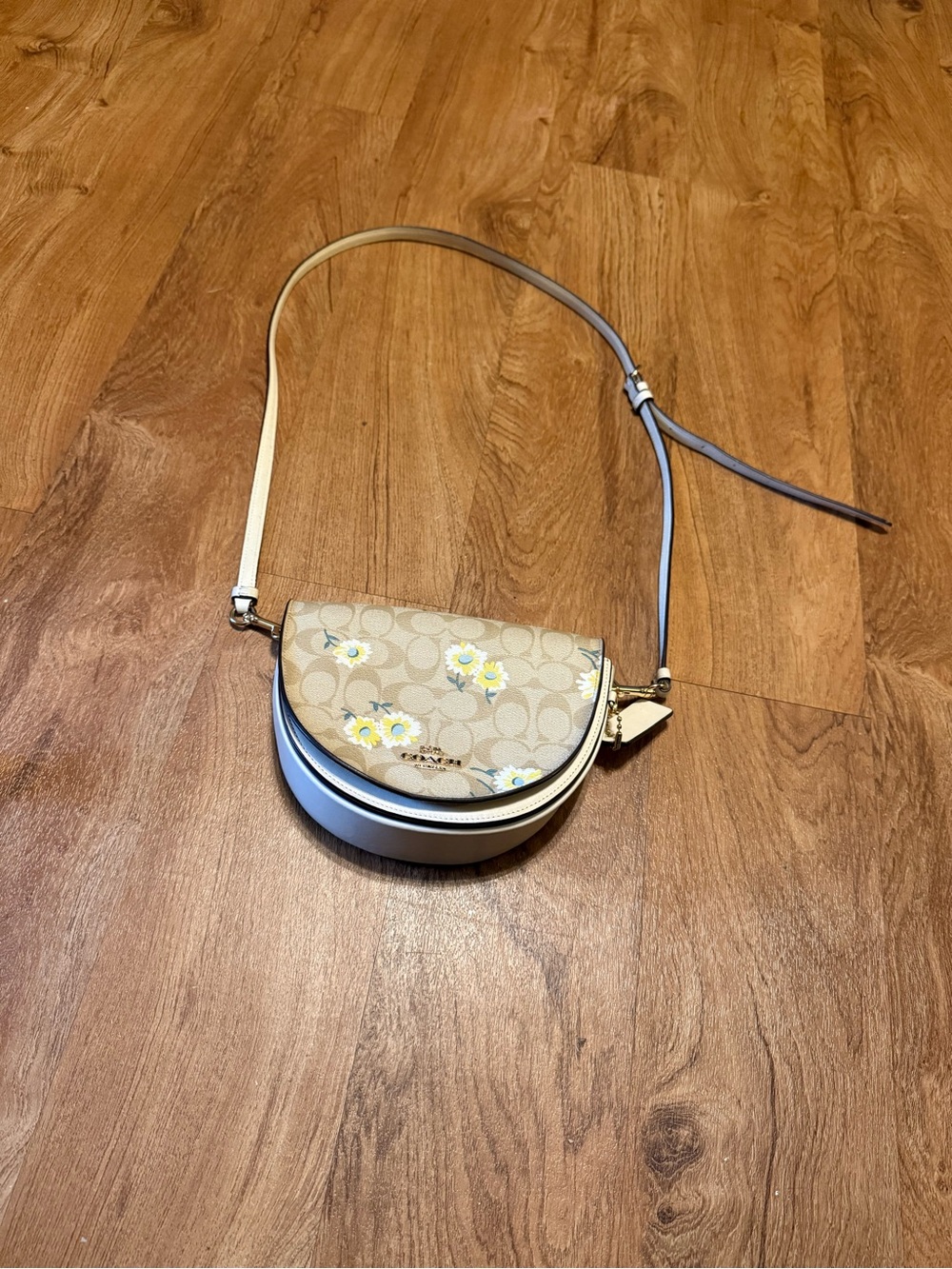 Coach Floral Signature Saddle Crossbody in Beige and white
